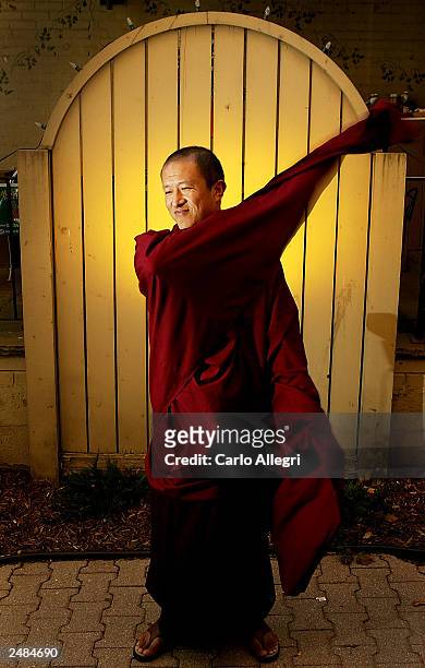 Writer/Director Khyentse Norbu of the movie 'Travellers & Magicians' poses for photographs at the Hotel Intercontinetal during the 2003 Toronto...