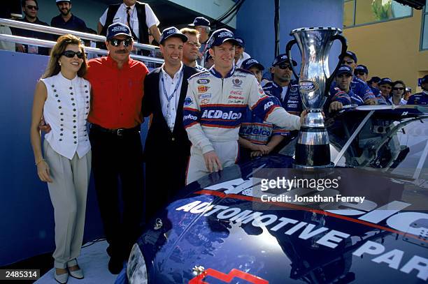 Dale Earnhardt Sr. , owner of the Busch car, poses with driver Dale Earnhardt Jr. And Teresa Earnhardt after the win in the Hotwheels.com 300 at the...