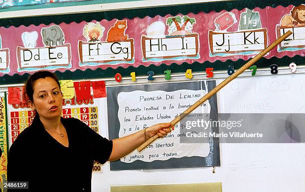 Lourdes Carmona, a Spanish speaking first grade teacher, instructs a class on the Spanish pronunciations of the alphabet at Birdwell Elementary...
