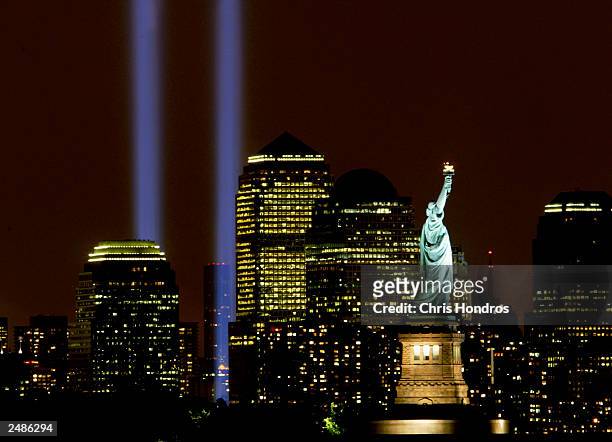 Two columns of light symbolize the fallen World Trade Center towers in a tribute in light September 11, 2003 in New York City. The light tribute that...