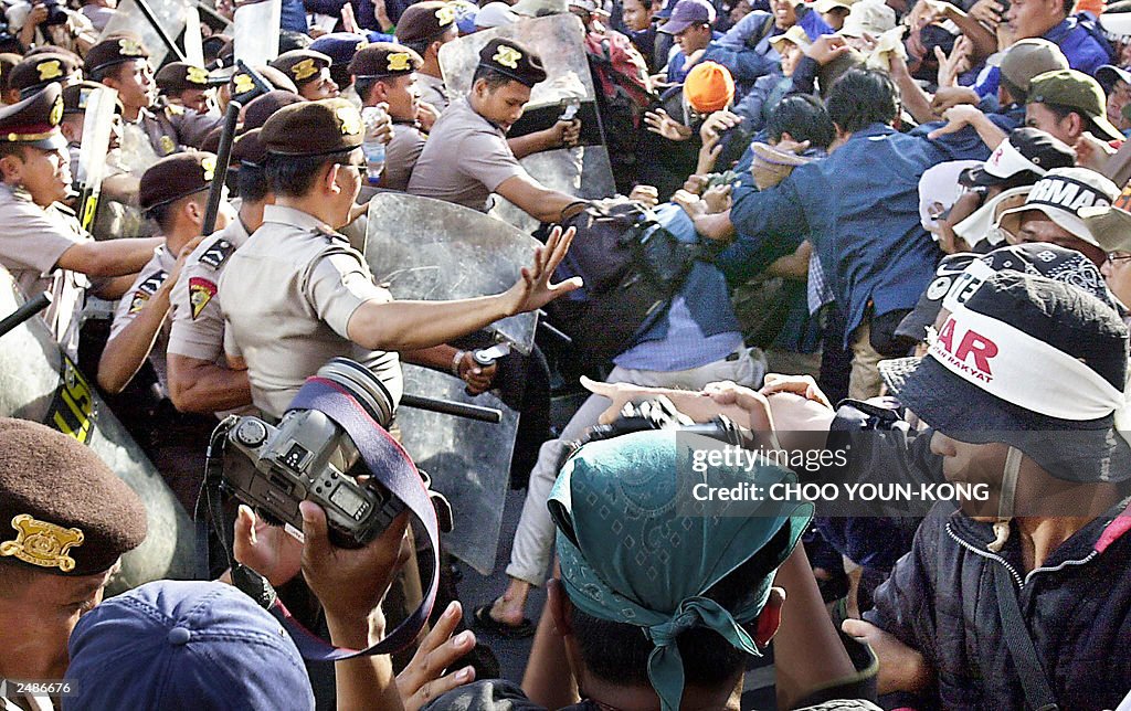 Indonesian riot police beat student demo