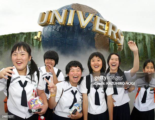 Japanese students enjoy their visit at Hollywood theme park Universal Studios Japan in Osaka, western Japan, 03 July 2003. Hollywood studio...