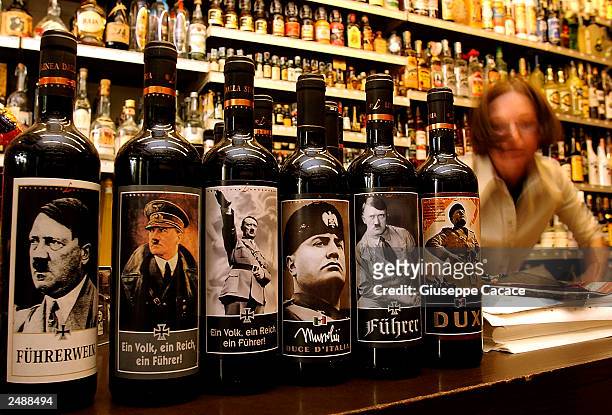 Bottles of "Lunardelli Wine" with labels depicting Nazi leader Adolf Hitler and facist dictator benito Mussolini are displayed in a wine shop...