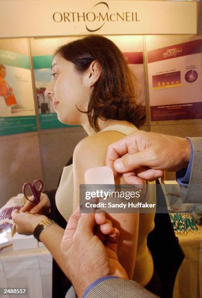 Becca Dillur models an Ortho Evra contraceptive patch September 12, 2003 at the Association of Reproductive Health Professional convention in La...