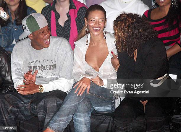 Rapper Jay Z and singer Beyonce Knowles with her mother Tina are seen at the Rosa Cha by Amir Slama Spring/Summer 2004 Collection at Bryant Park...
