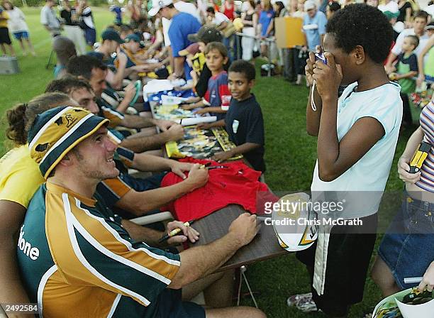Nathan Gray poses as local Darwin residents take pictures and collect autographs during the Australian Wallabies training session held at Optus Oval...