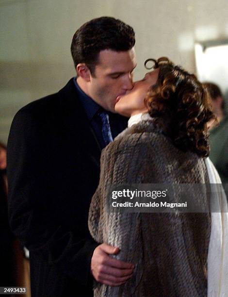 Actor Ben Affleck and his girlfriend actress Jennifer Lopez kiss while filming on the set of "Jersey Girl." Lopez and Affleck postponed their...