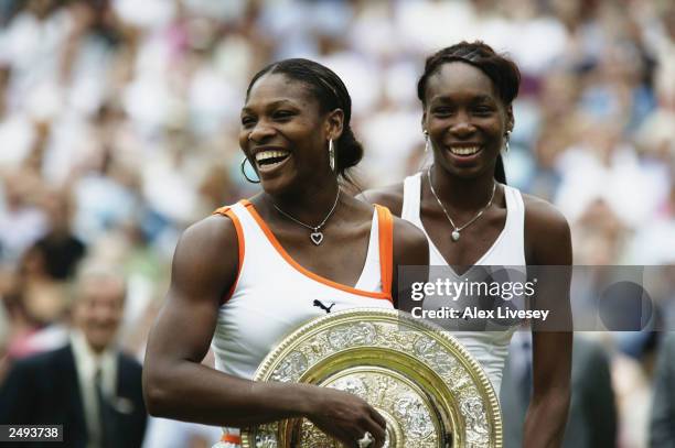 This file photo shows Serena Williams of the USA holding the trophy after her match against sister Venus Williams of the USA in the Womens Singles...