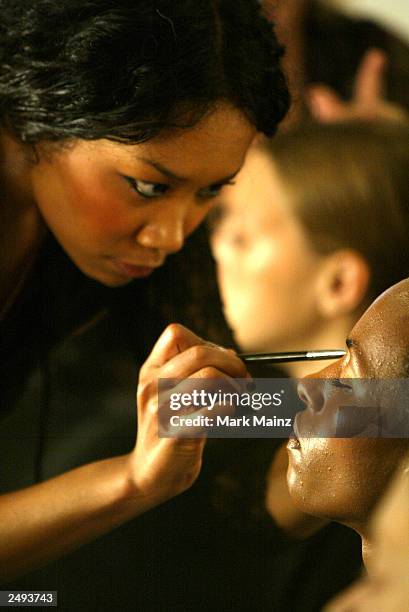 Model prepares backstage for the Alice Roi Spring/Summer 2004 Fashion Show at Maurice Villency during the 7th on Sixth Mercedes-Benz New York Fashion...