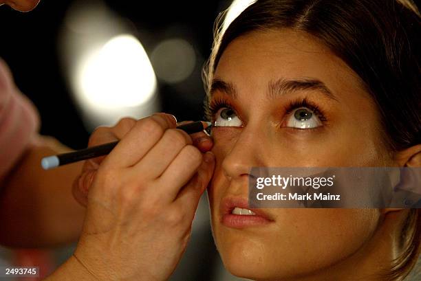 Model prepares backstage for the Alice Roi Spring/Summer 2004 Fashion Show at Maurice Villency during the 7th on Sixth Mercedes-Benz New York Fashion...