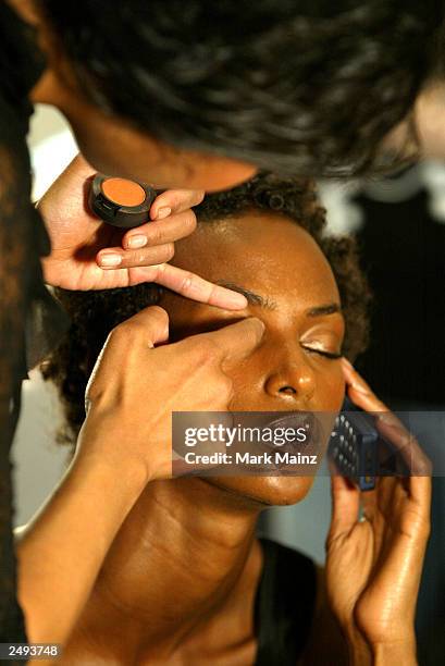 Model prepares backstage for the Alice Roi Spring/Summer 2004 Fashion Show at Maurice Villency during the 7th on Sixth Mercedes-Benz New York Fashion...