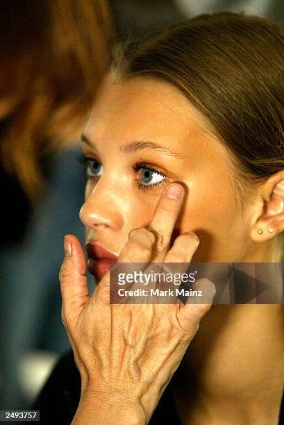 Model prepares backstage for the Alice Roi Spring/Summer 2004 Fashion Show at Maurice Villency during the 7th on Sixth Mercedes-Benz New York Fashion...