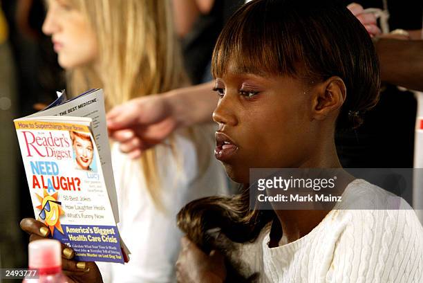 Model prepares backstage for the Alice Roi Spring/Summer 2004 Fashion Show at Maurice Villency during the 7th on Sixth Mercedes-Benz New York Fashion...
