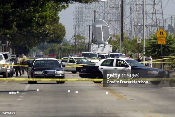 Compton Sheriff officers are shown at the crime scene where 31-year-old Yetunde Price, the older sister of tennis stars Venus and Serena Williams,...