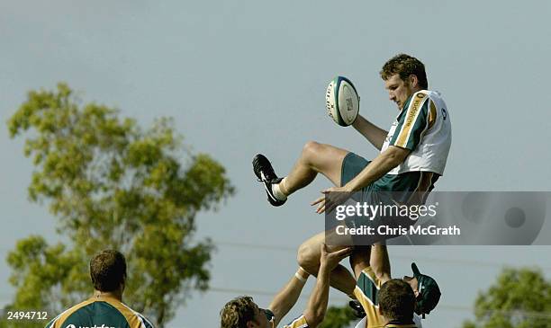 Justin Harrison runs through lineout drills during the Australian Wallabies training session held at Optus Oval September 15, 2003 in Darwin,...