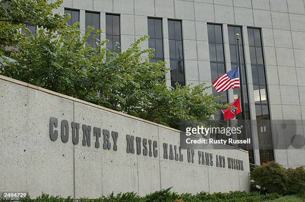 Flags fly at half mast in honor of Johnny Cash at the Country Music Hall of Fame September 14, 2003 in Nashville, Tennessee. Cash died in a Nashville...
