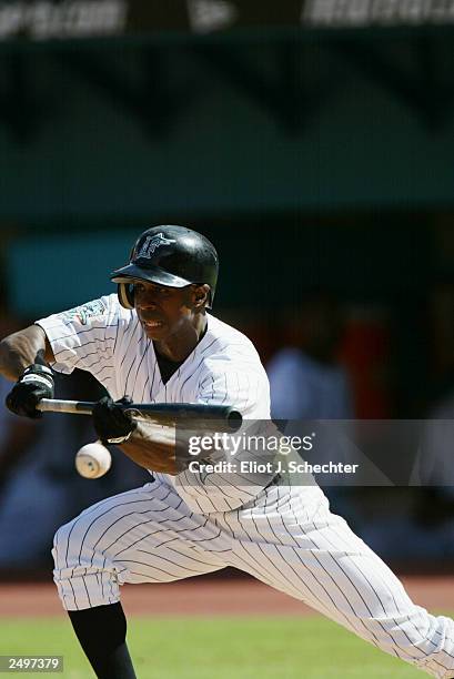 Center Fielder Juan Pierre of the Florida Marlins bunts in the first inning during the game against the Montreal Expos on September 1, 2003 at Pro...