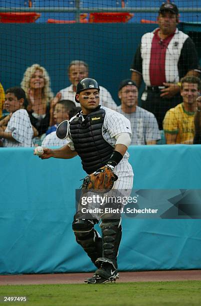 Catcher Ivan "Pudge" Rodriguez of the Florida Marlins chases down a pop against the Montreal Expos during the game on September 1, 2003 at Pro Player...