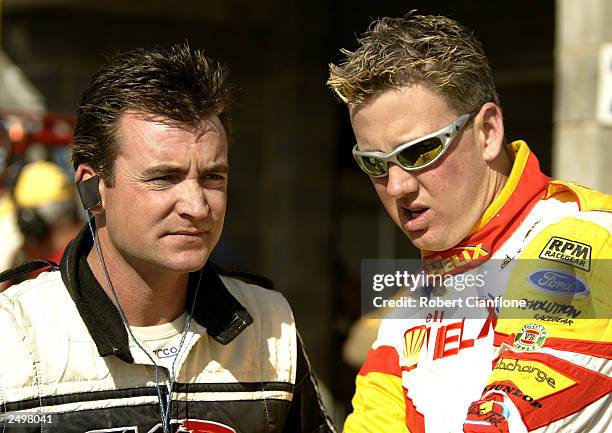 Craig Baird of Team Kiwi Racing and Steven Johnson of Shell Helix Racing have a friendly chat during practice for the Sandown 500 which is round 9 of...