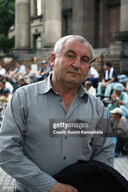 Big Issue founder John Bird poses in front of a church where many homeless people gather on September 16, 2003 in Osaka, Japan. Bird has chosen...