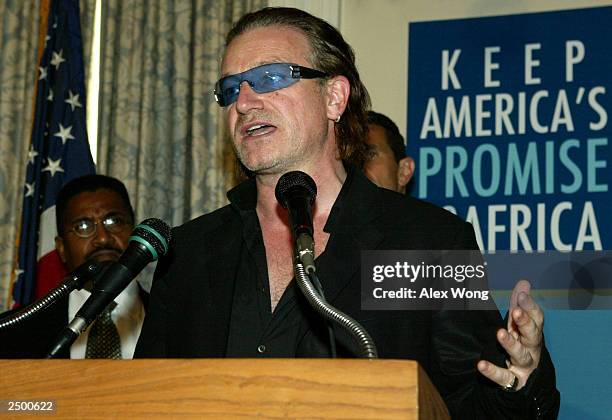 Bono, lead singer of music group U2, speaks during a news conference on America's promise to Africa September 16, 2003 in Washington, DC. Along with...