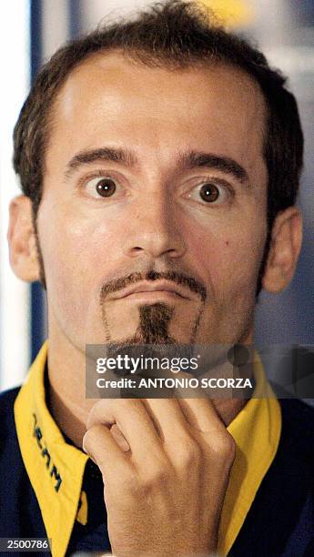 Italian MotoGP rider Maximiliano Biaggi listens to a question 16 September during a Honda-Pons team press conference in Rio de Janeiro, Brazil....