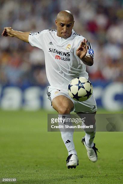Roberto Carlos of Real Madrid in action during the UEFA Champions League Group F match between Real Madrid and Olympic Marseille at the Santiago...