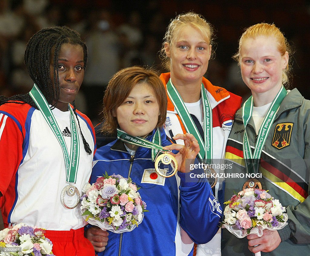 Japanese Masae Ueno (2nd L), winner of t