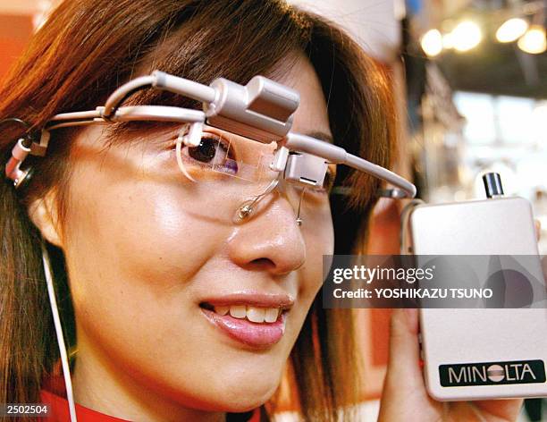 Japanese optical giant Minolta unveils a prototype of glasses shaped with a full-color holographic display, called "Holographic See-through Display",...