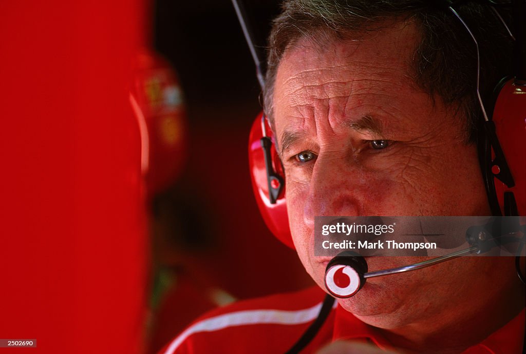 Ferrari team principal Jean Todt watches the monitor