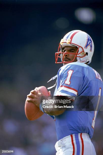 Quarterback Warren Moon of the Houston Oilers sets to pass during an NFL game against the Cleveland Browns at Cleveland Stadium on October 29, 1989...