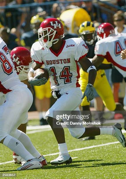 Ricky Wilson of the Houston Cougars carries the ball against the Michigan Wolverines on September 6, 2003 in Ann Arbor, Michigan. Michigan defeated...