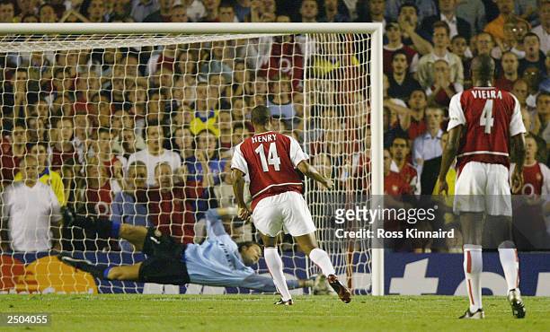 Francesco Toldo of Inter Milan palms away Thierry Henry's penalty during the UEFA Champions League First Stage Group B match between Arsenal and...