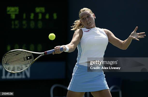 Barbara Schett of Austria returns a shot to Janette Husarova of Slovakia during the US Open on August 25, 2003 at the USTA National Tennis Center,...