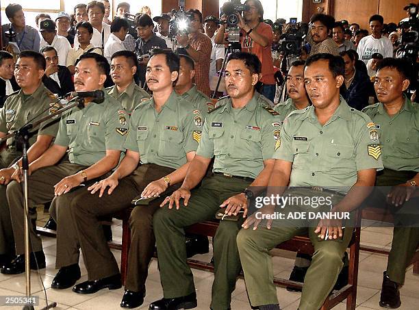 Ten soldiers line up in the court room during the first trial on the massacre of Muslim protestors in Jakarta's Tanjung Priok harbour area 19 years...