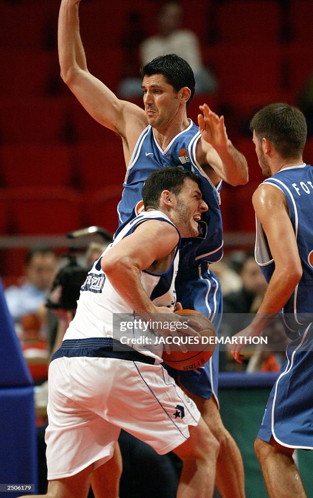 Israel's Ido Kozikaro runs into an unidentified Greek player, 12