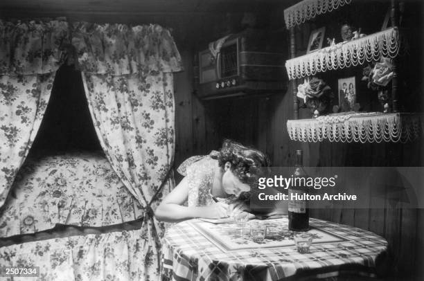Parisian woman writes a letter, 16th August 1952. Picture Post - 6002 - Paris Pride - pub. 1952