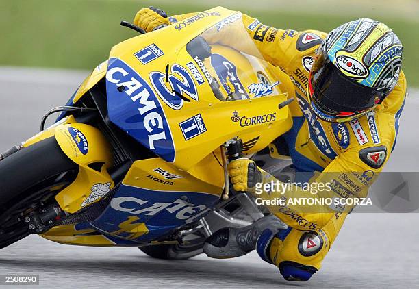 Italian MotoGP rider Maximiliano Biaggi powers his Honda Pons, 18 September 2003, during the first training session at Nelson Piquet autodrome in Rio...
