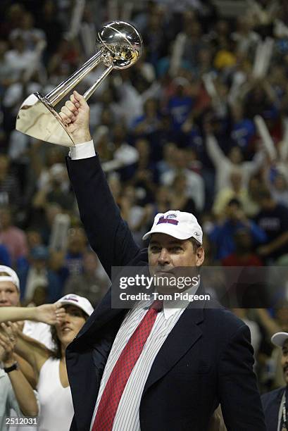 Head coach Bill Laimbeer of the Detroit Shock raises the 2003 WNBA championship trophy after defeating the two-time champion Los Angeles Sparks in...