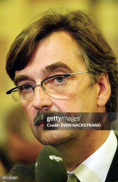 Defence Lawyer Gunnar Falk speaks to reporters after leaving the court room 19 September 2003, after Stockholm's district court ordered the continued...