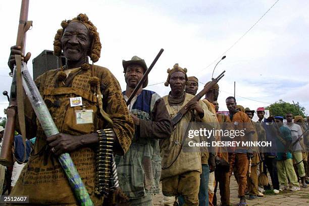 Dozo hunters holding rifles perform dances during a ceremony organized by these traditional Ivorian hunters, allied of the "New Forces" rebel...