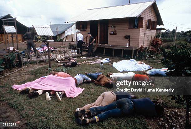 Investigators examine the compound of the People's Temple cult November 18, 1978 in Jonestown, Guyana after over 900 members of the cult, led by...