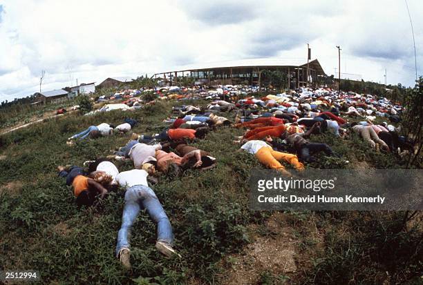 Dead bodies lie near the compound of the People's Temple cult November 18, 1978 in Jonestown, Guyana after over 900 members of the cult, led by...