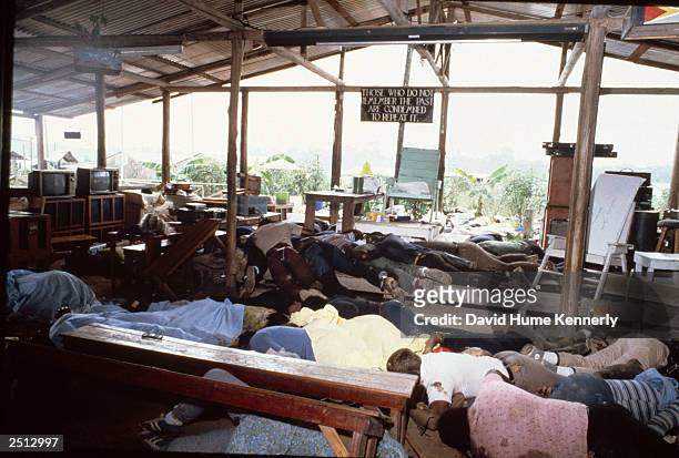 Dead bodies lie in the compound of the People's Temple cult November 18, 1978 in Jonestown, Guyana after over 900 members of the cult, led by...