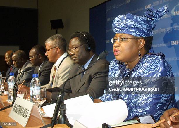 Nigerian Minister of Finance Ngozi Okonjo-Iweala talks to the press as Minister of Budget and Finance Jean Baptiste Compaore of Burkina Faso and...