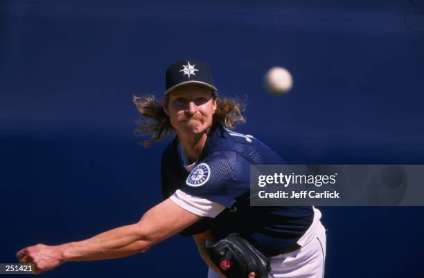 Randy Johnson of the Seattle Mariners pitching during the spring training game between the Seattle Mariners and the San Diego Padres at the Peoria...