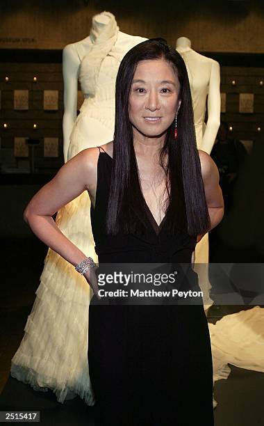 Vera Wang poses with the Vera Wang bridal exhibit at the Whitney Museum of American Art as part of the Wedding March On Madison September 20, 2003 in...