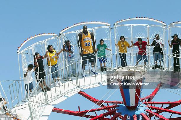 Shaquille O'Neal rides a Tilt-O-Wheel at the childrens benefit "Shaqtacular VIII" held at the Santa Monica Airport on September 20, 2003 in Santa...