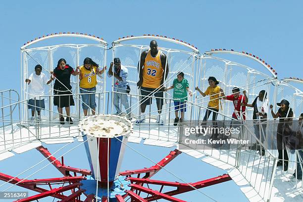 Shaquille O'Neal rides a Tilt-O-Wheel at the childrens benefit "Shaqtacular VIII" held at the Santa Monica Airport on September 20, 2003 in Santa...