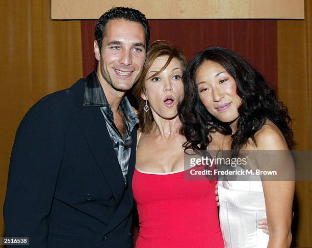 Actors Raoul Bova, Diane Lane and Sandra Oh attend the film premiere of "Under The Tuscan Sun" at the El Capitan Theatre on September 20, 2003 in...